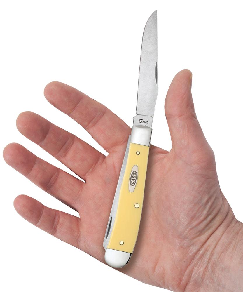 Yellow Synthetic Trapper with Clip Carbon steel Knife in Hand