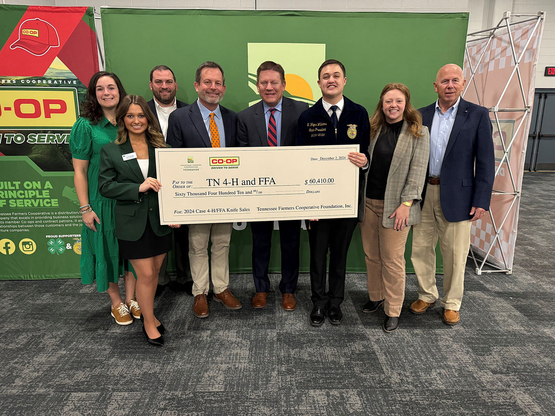 ennessee Farmer's Cooperative Foundation members with the oversized check.