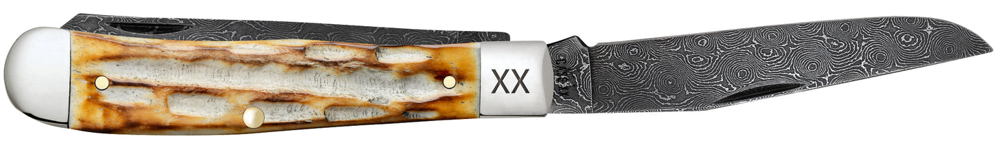 Deep Canyon Jigged Burnt Natural Bone Raindrop Damascus Trapper Open