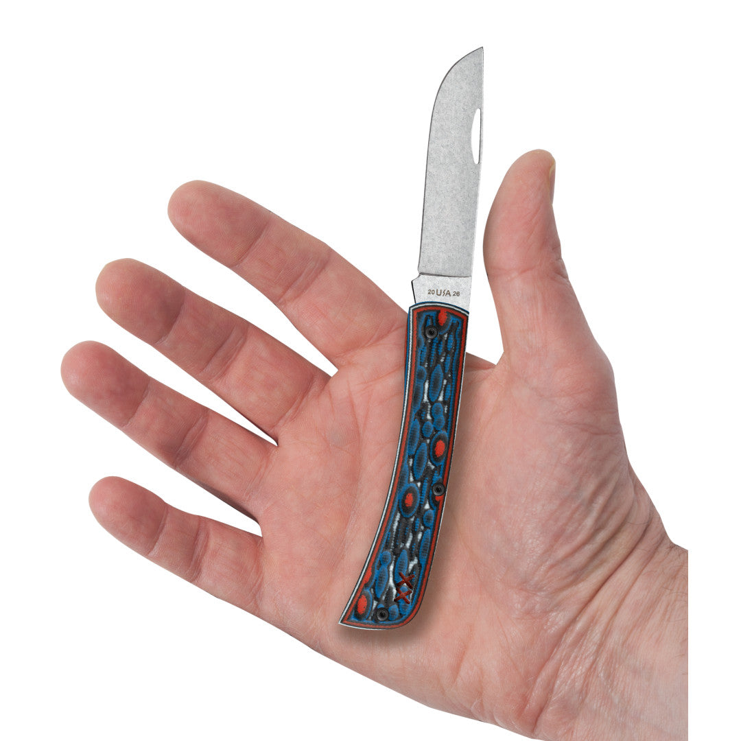 Crossroads™ Fossil Jig Sonic Blast Multi Cut w/ Current Red G-10 XR Sod Buster® Jr in Hand