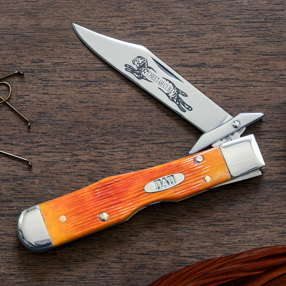 2026 Father's Day Cheetah Cub Case knife on a wooden surface.