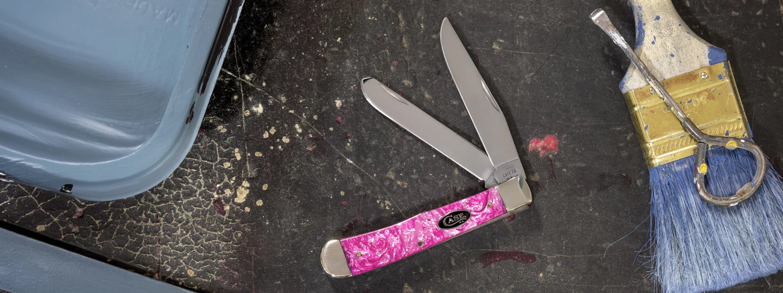 Pink case knife on a dark surface