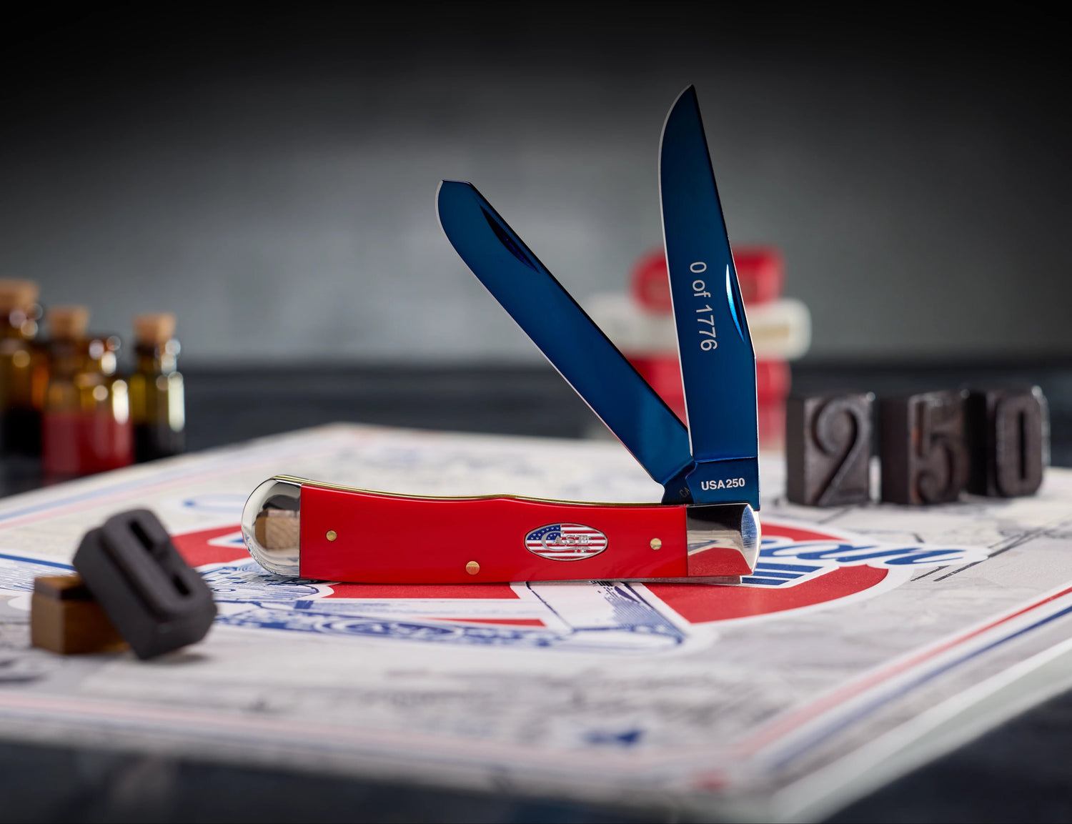 Red and blue Case knife on a poster with decorations in the background