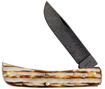 Deep Canyon Jigged Burnt Natural Bone Raindrop Damascus Sod Buster Jr Front View