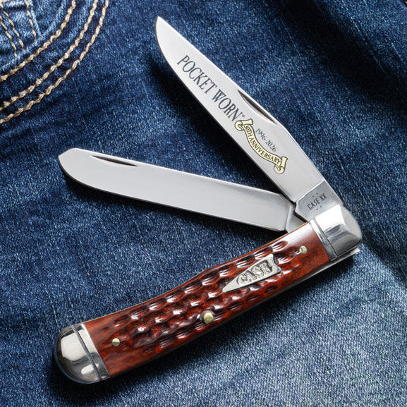 Brown Case knife on a pair of blue jeans.
