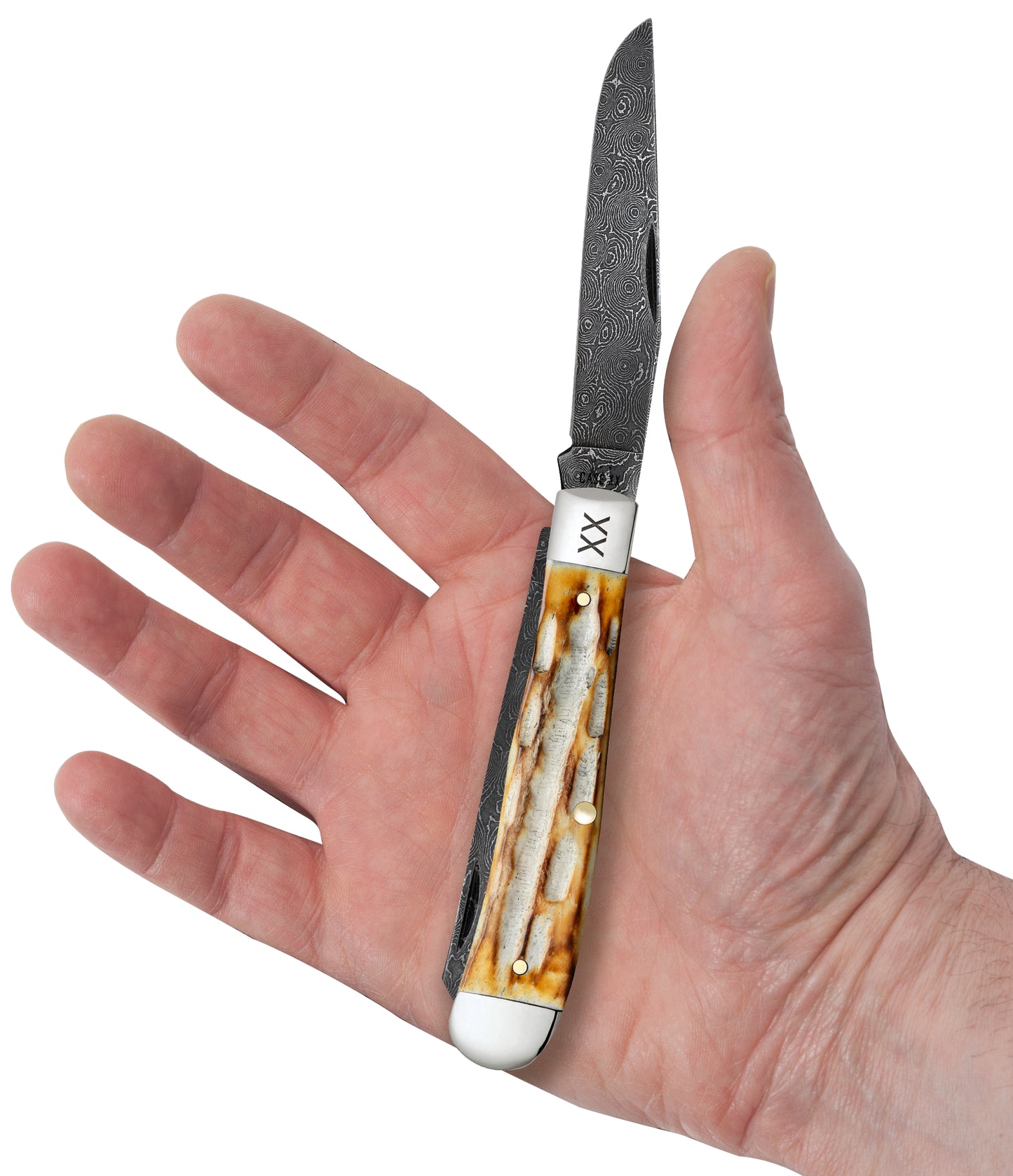 Deep Canyon Jigged Burnt Natural Bone Raindrop Damascus Trapper In Hand