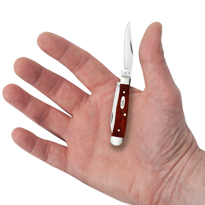 Smooth Chestnut Bone Tiny Trapper in Hand