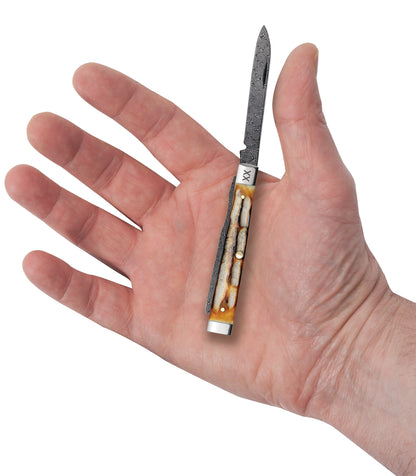 Deep Canyon Jigged Burnt Natural Bone Raindrop Damascus Baby Doc In Hand