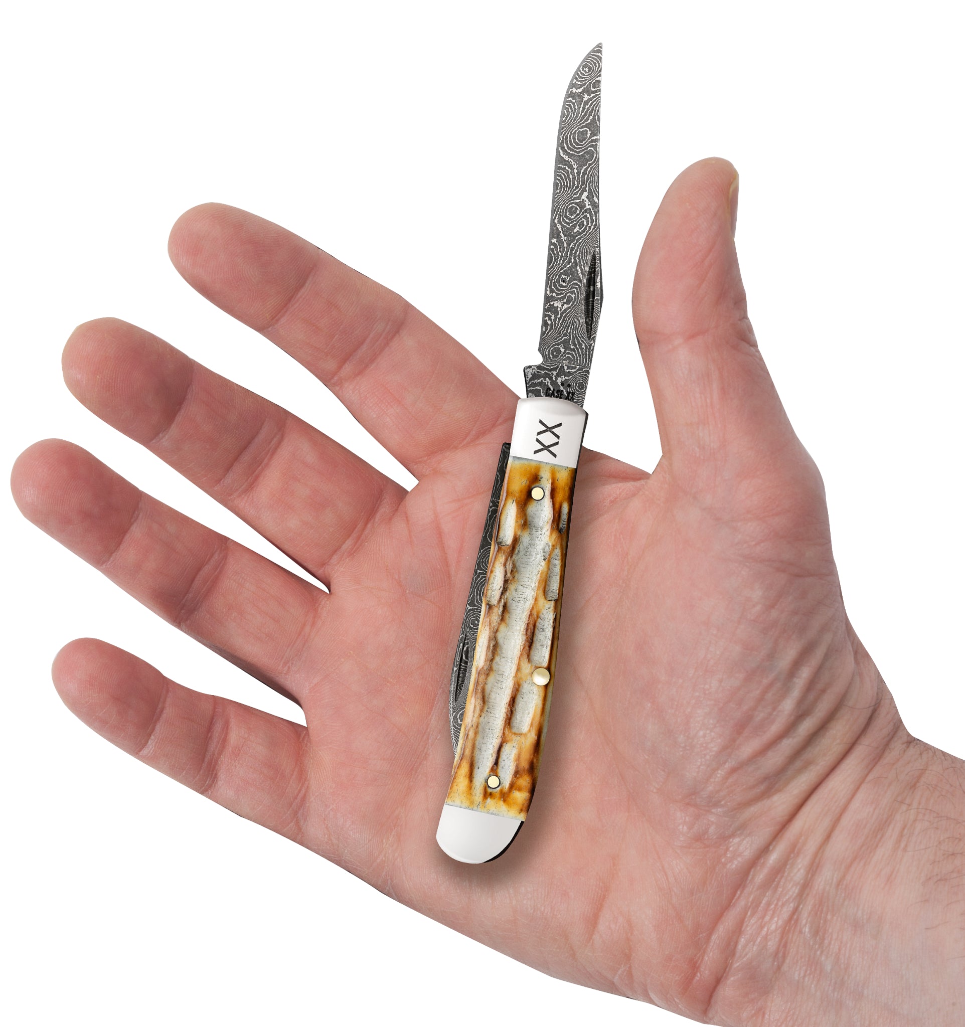 Deep Canyon Jigged Burnt Natural Bone Raindrop Damascus Mini Trapper In Hand