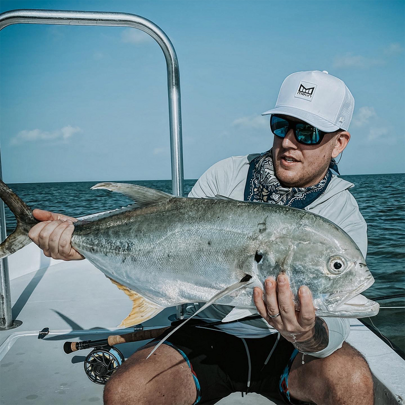 BO WENTWORTH: Holding a large fish on a boat with ocean and sky in the background