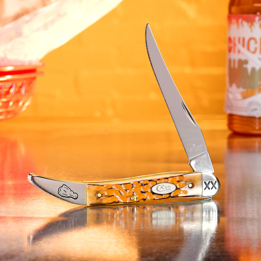 Case knife with a decorative handle on a table.
