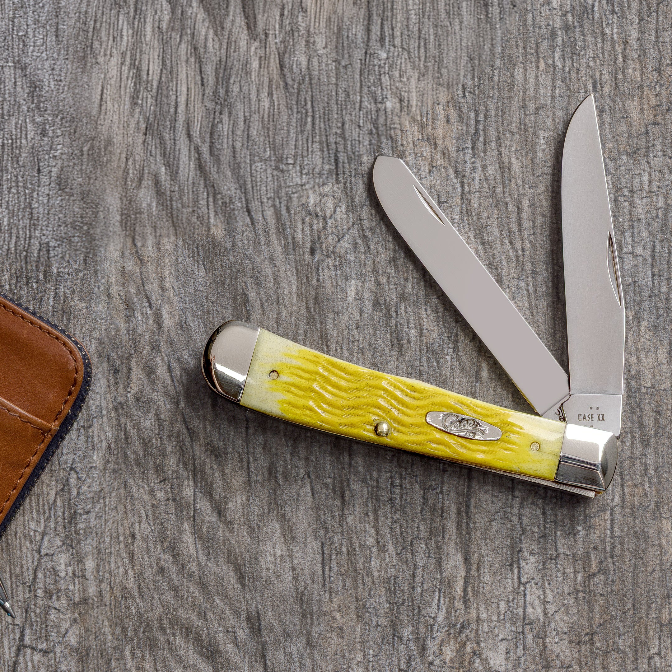 Platts Jig Yellow Bone Trapper on a gray wood background.