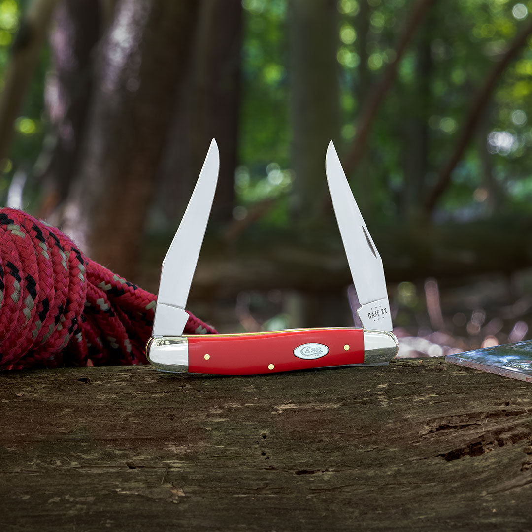 Smooth Red Synthetic Trapper in forest setting.