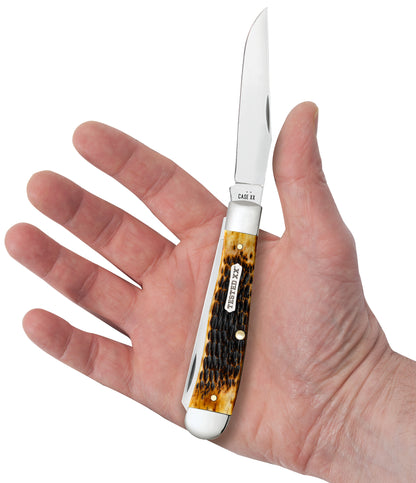 Rogers Jigged Burnt Amber Bone CS Trapper In Hand