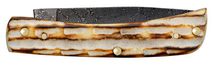 Deep Canyon Jigged Burnt Natural Bone Raindrop Damascus Sod Buster Jr Closed