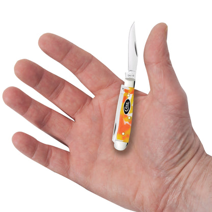 Smooth Candy Corn Kirinite® Tiny Trapper in hand.