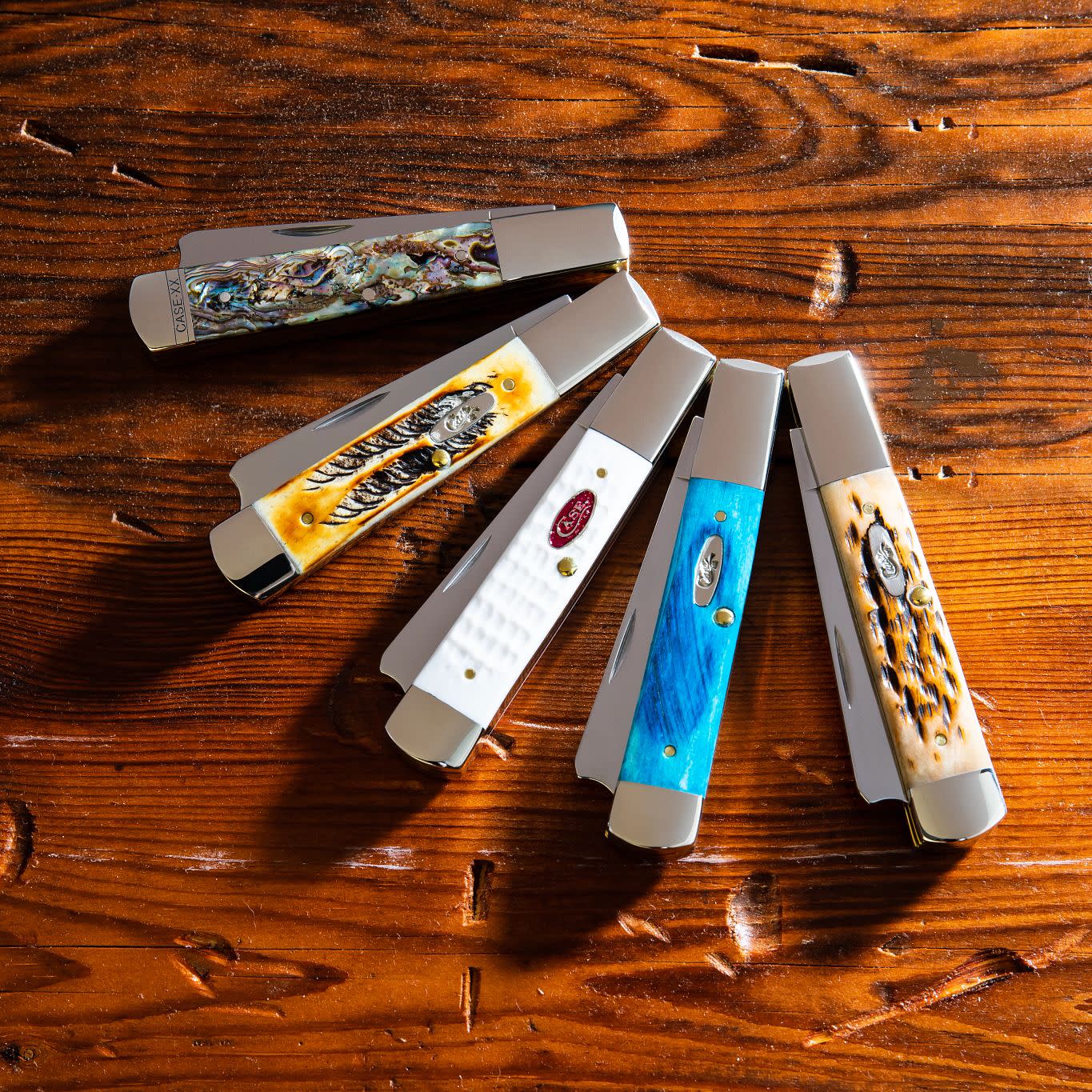 Closed Razor Knives on a Wooden Background