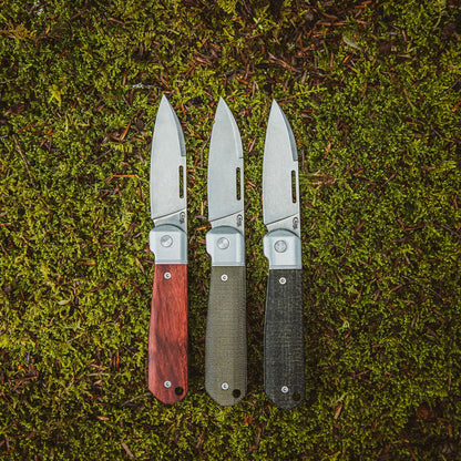 All Highbanks® Knives on a Grass Background