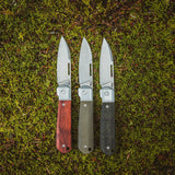 All Highbanks™ Knives on a Grass Background 