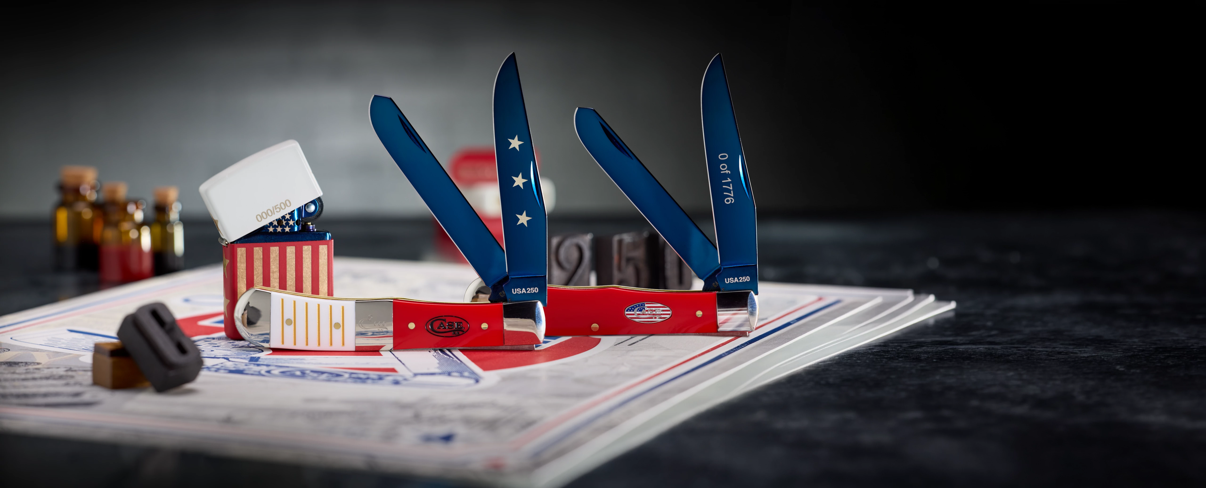 Two Case knives and one Zippo lighter with a dark background.