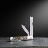 Smooth Abalone Razor on a Marble Table with a Black Background