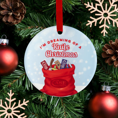 Lifestlye image of CCC® 2025 Christmas Ornament
hanging on tree with red ornaments