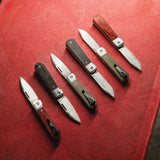 Longhouse™ Knives on a Red Background 