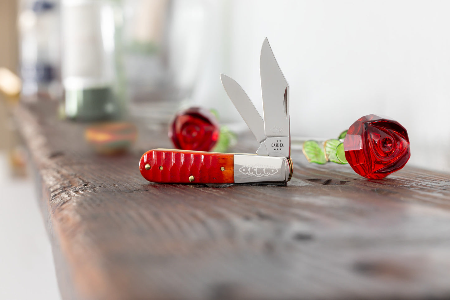 Lifestyle image of CCC® Gator Jig Indian Paintbrush Bone Barlow
on wooden edge with rose crystal decorations.