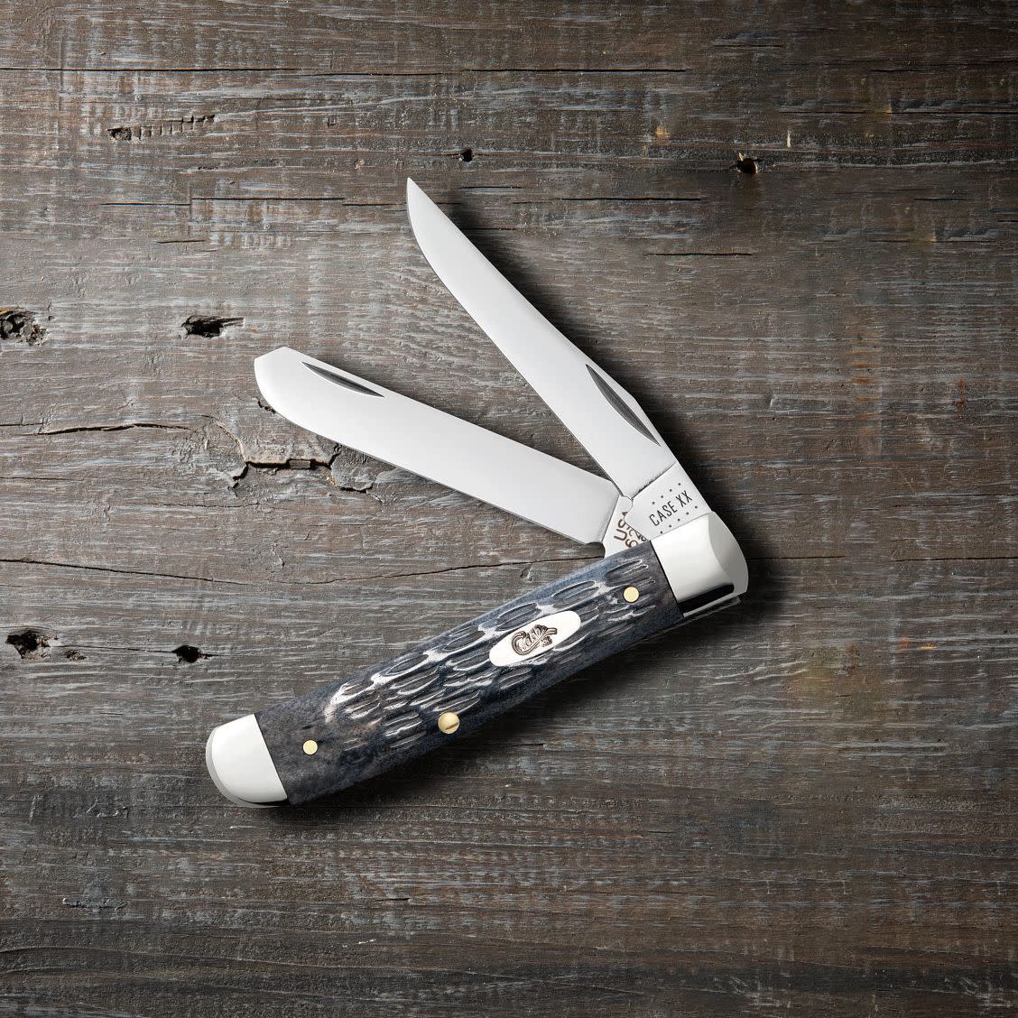 Pocket Worn® Crandall Jig Gray Bone Mini Trapper Knife on Wooden Background
