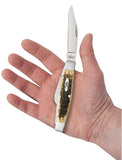 Peach Seed Jig Amber Bone CS Large Stockman Knife in Hand