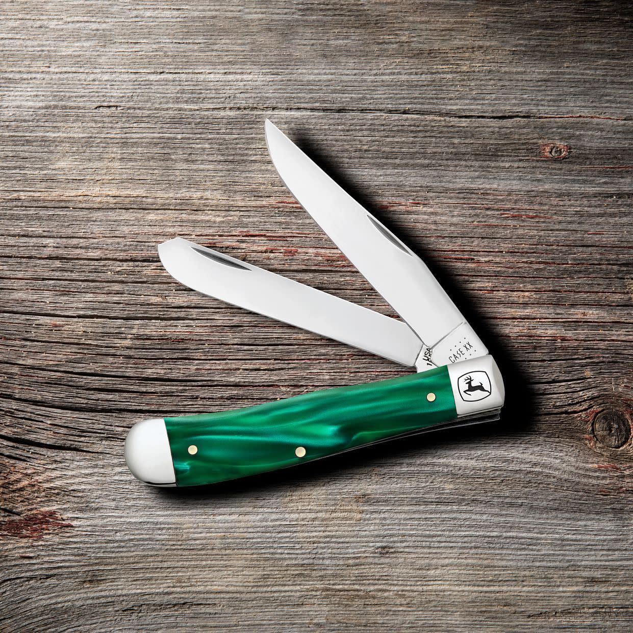 John Deere Smooth Green Pearl Kirinite® Trapper Knife on Wooden Background