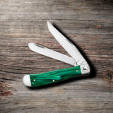 John Deere Smooth Green Pearl Kirinite® Trapper Knife on Wooden Background
