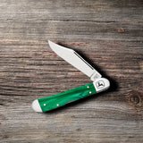 John Deere Smooth Green Pearl Kirinite® Mini Copperlock® Knife on Wooden Background