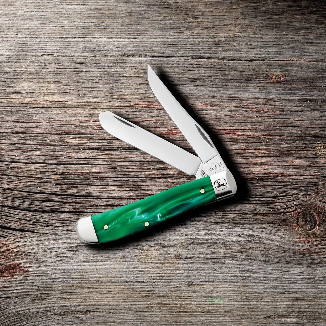 John Deere Smooth Green Pearl Kirinite® Mini Trapper Knife on Wooden Background