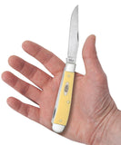Yellow Synthetic Trapper with Clip Carbon steel Knife in Hand