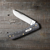 Pocket Worn® Crandall Jig Gray Bone Sod Buster Jr® Knife on Wood Background