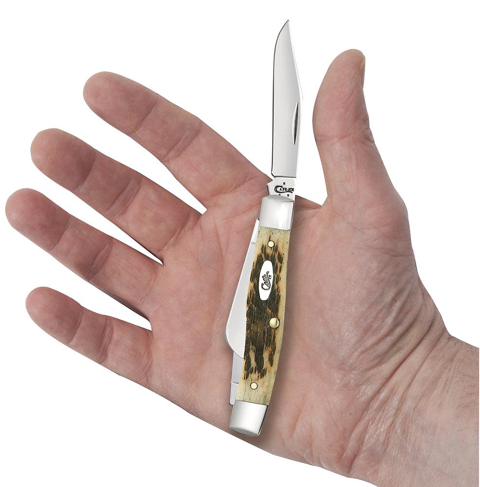 Peach Seed Jig Amber Bone CS Medium Stockman with Pen Blade Knife in Hand