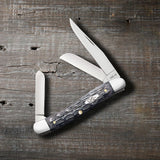 Pocket Worn® Crandall Jig Gray Bone Medium Stockman Knife on Wooden Background