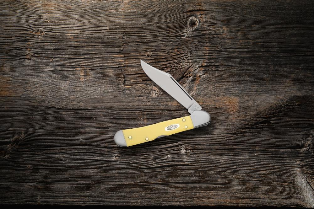 Yellow Synthetic CS Mini CopperLock® Knife on Wood Background