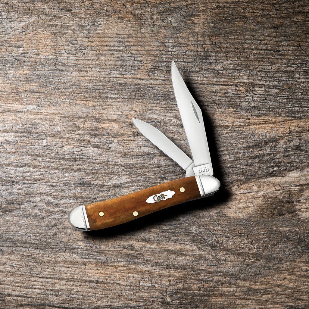 Smooth Antique Bone Peanut Knife on Wooden Background