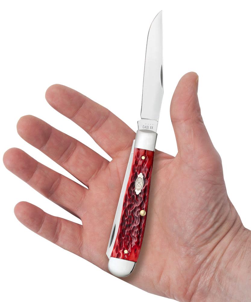 Peach Seed Jig Dark Red Bone CS Trapper Knife in Hand