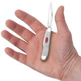 SparXX™ Standard Jig White Synthetic Peanut Knife in Hand