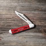 Chevrolet® Embellished Red Synthetic Smooth Mini CopperLock® Knife on Wooden Background