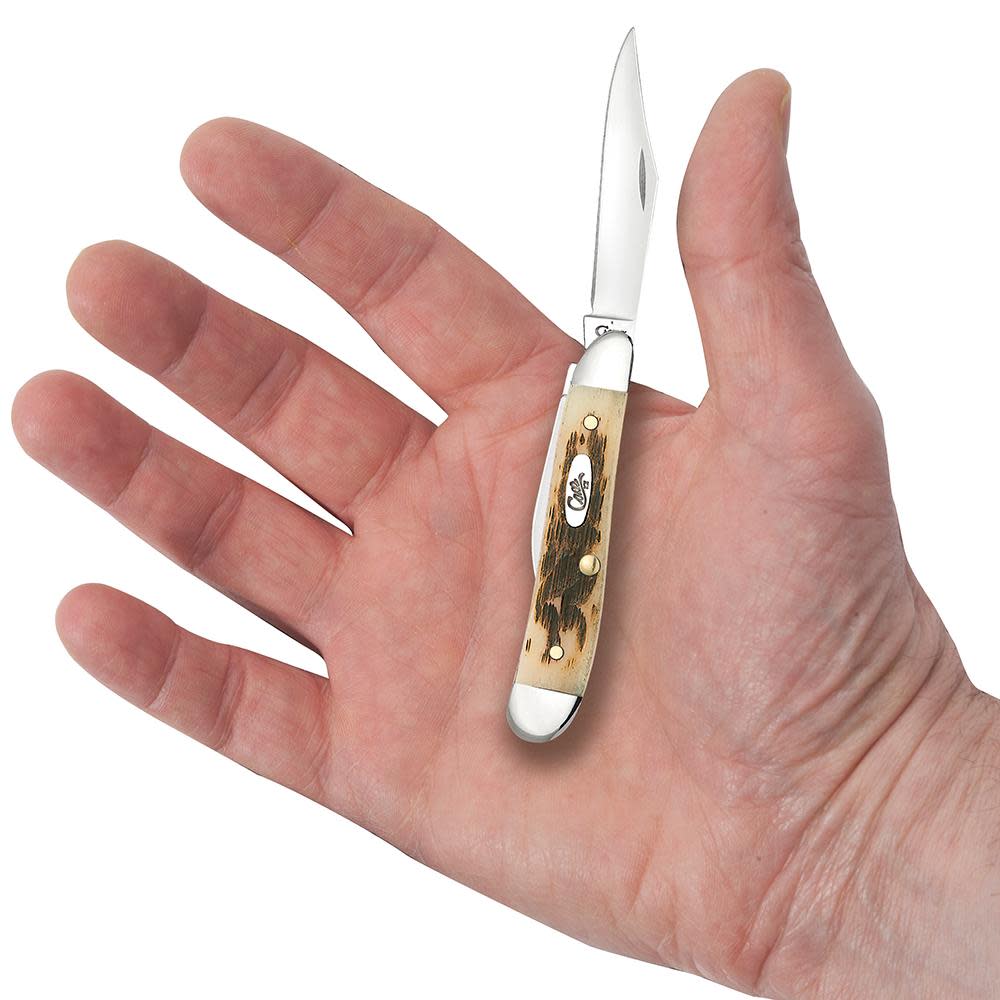 Amber Bone Peach Seed Jig Peanut Knife in Hand