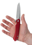 Red Anodized Aluminum Kinzua® with Spear Blade Knife in Hand
