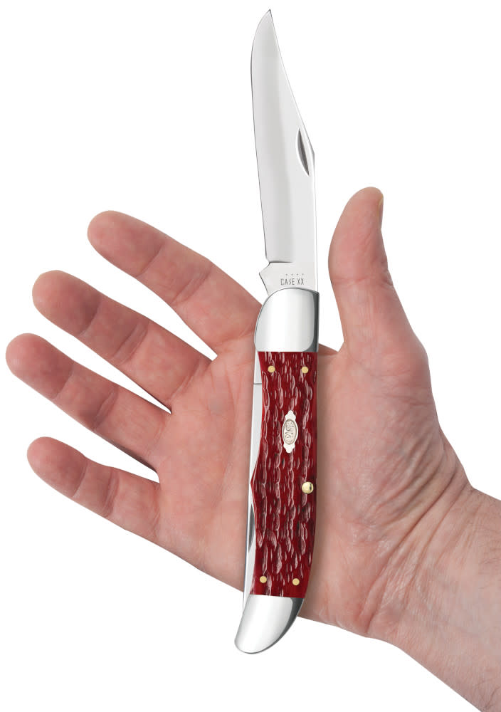 Peach Seed Jig Dark Red Bone CS Folding Hunter with Sheath Knife in Hand