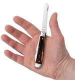 Front view of the Smooth Caramel Swirl Kirinite® Mini Trapper showing the Clip blade fully extended in hand